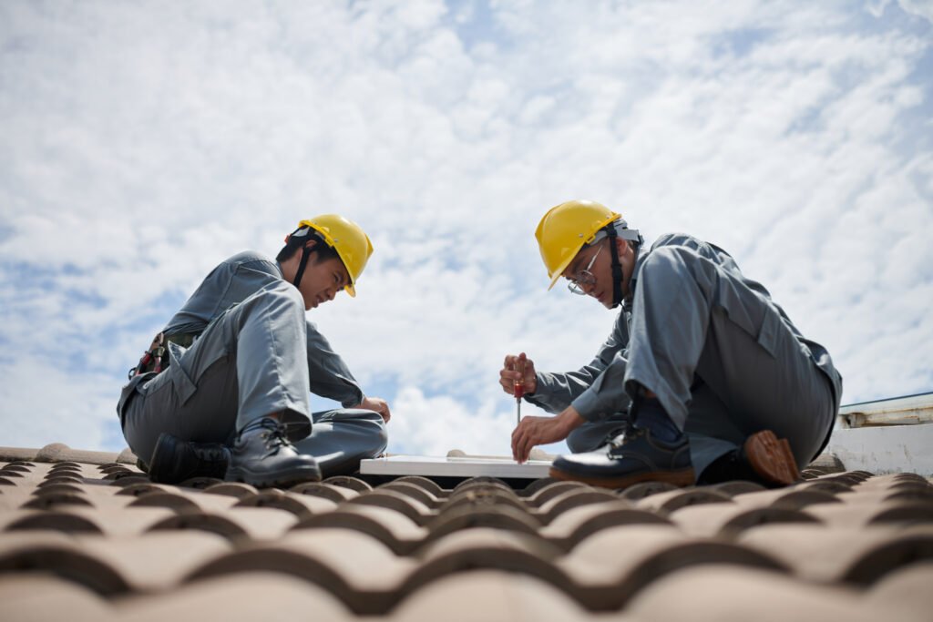 builders hardhats uniform installing solar panels tile roof | Vanhook Roofing and Exteriors