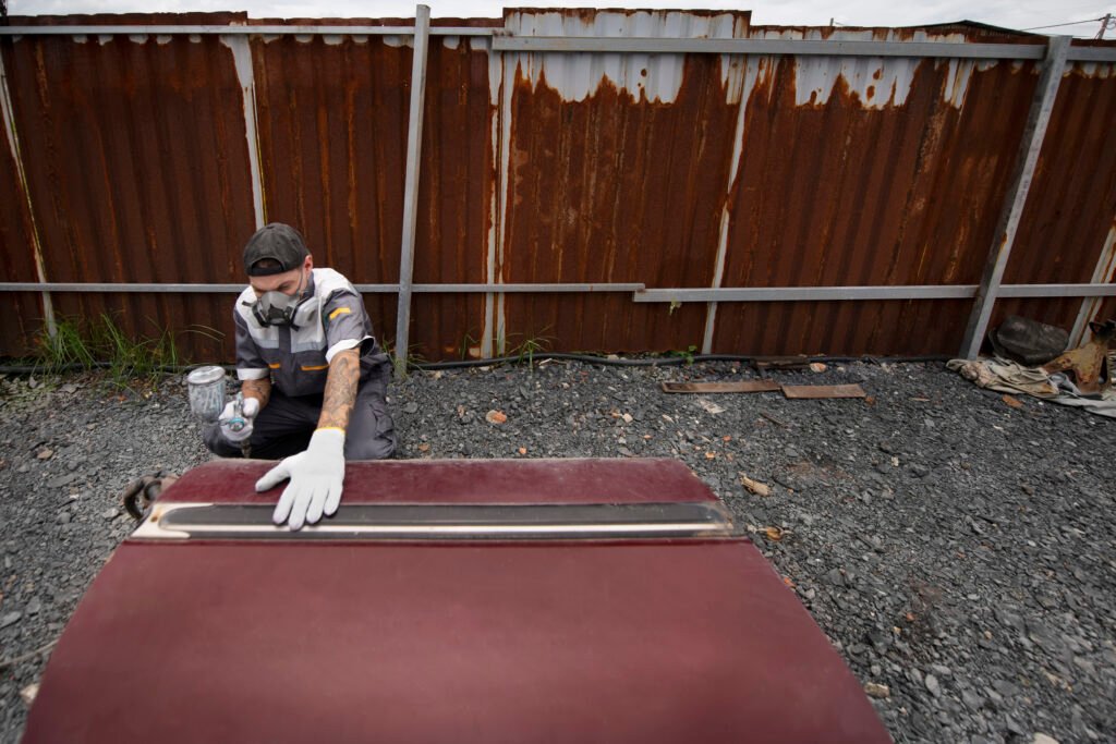 man working outdoors high angle | Vanhook Roofing and Exteriors