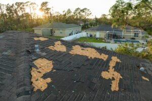 Blog Vanhook Roofing and Exteriors in Wylie, TX - Vanhook Roofing and Exteriors damaged house roof with missing shingles after hurricane ian florida consequences natural disaster 1 | Vanhook Roofing and Exteriors