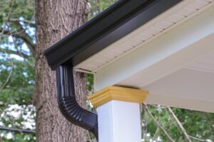 Blog Vanhook Roofing and Exteriors in Wylie, TX - Vanhook Roofing and Exteriors rain gutter roof with downpipe new metal pipe corner 1 | Vanhook Roofing and Exteriors